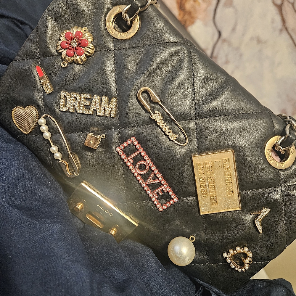 ALDO Black Quilted Bag with Gold and Red Accents